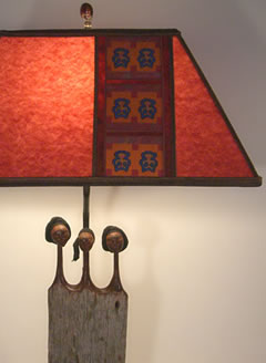 t000 African Sisters lamp and parchment red lamp shade 